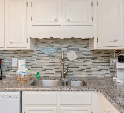 Your fully equipped kitchen awaits with granite counters, modern appliances, and thoughtful touches for preparing meals during your stay.