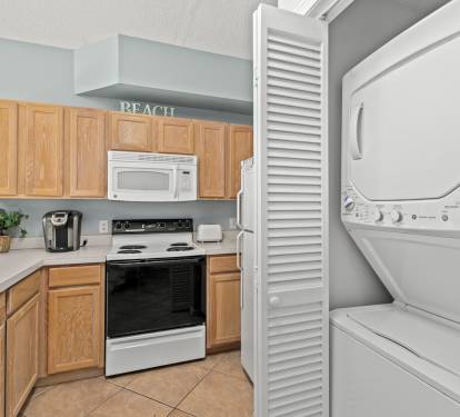 Your beach-themed kitchen comes equipped with everything you need, plus convenient in-unit washer and dryer for effortless vacation laundry.