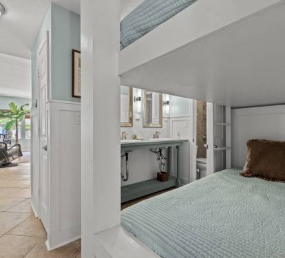 Your cozy bunk bed nook offers comfort and style, with the ensuite bathroom just steps away for ultimate convenience.