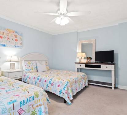 Drift off to sleep in this cheerful twin bedroom, where beach-themed decor and soft blue walls create your perfect coastal retreat.