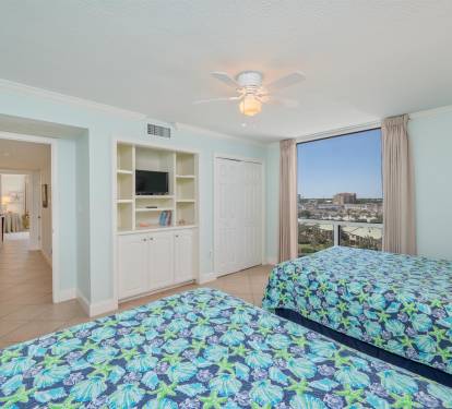 Wake up to stunning city views in your bright twin bedroom, featuring built-in entertainment center and peaceful coastal vibes.