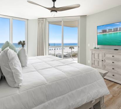Wake up to stunning ocean views in your serene bedroom retreat, where coastal breezes and pristine white linens create the perfect sanctuary.
