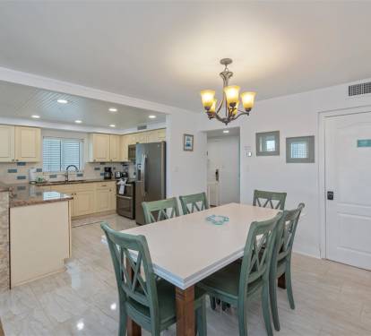 Gather around your spacious dining table for memorable meals while the fully equipped kitchen awaits your culinary adventures.