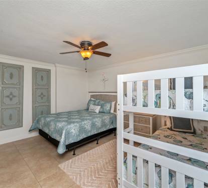 Your family bedroom features both queen and bunk beds, perfect for kids and adults to rest together comfortably.