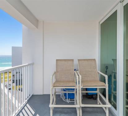 Step onto your private balcony and soak up the stunning ocean breeze while relaxing in comfortable seating with breathtaking sea views.