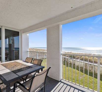 Your private balcony offers stunning oceanfront views where you can dine alfresco while watching waves meet the shore.