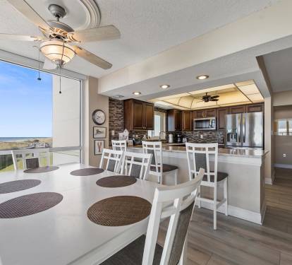 Your open-plan dining and kitchen area offers stunning ocean views while you cook and share meals together in this beautifully appointed space.