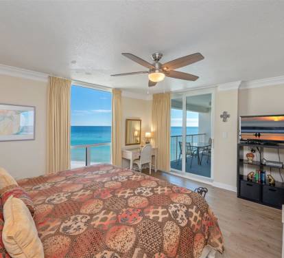 Wake up to breathtaking ocean views from your comfortable bedroom, where the ceiling fan keeps you cool and sliding doors lead to your private balcony.