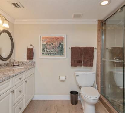Indulge in your elegant ensuite bathroom with granite counters, rainfall shower, and warm lighting for perfect morning routines.