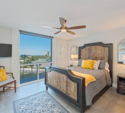 Drift off in your elegant bedroom with stunning views and tropical breezes from the ceiling fan.