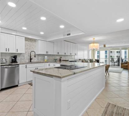 Cook your favorite meals in this stunning modern kitchen featuring granite countertops, stainless steel appliances, and abundant storage space.