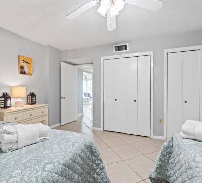 Sleep peacefully in your bright, coastal-themed twin bedroom with ceiling fan and ample closet space for your belongings.