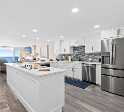 Your gourmet kitchen features granite countertops, stainless appliances, and stunning ocean views that make cooking a joy.