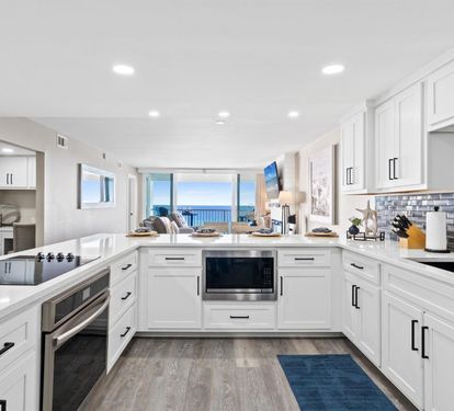 Cook with panoramic ocean views in your fully-equipped modern kitchen, complete with granite counters and stainless appliances.