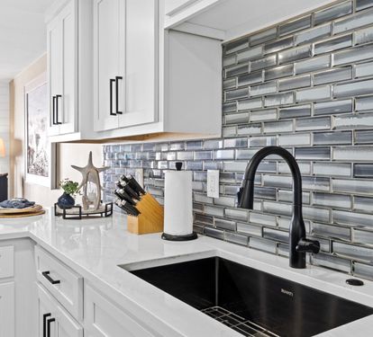 Your gourmet kitchen awaits with gleaming countertops, designer backsplash, and everything you need to create culinary memories.