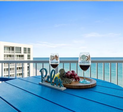 Savor wine and fresh fruit on your private balcony while watching waves dance beneath endless blue skies.