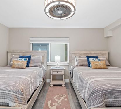 Your coastal retreat features Queen beds with nautical touches, perfect for friends or family sharing peaceful moments together.