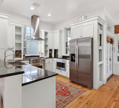 Cook memorable meals in your gourmet kitchen featuring gleaming granite counters, premium stainless steel appliances, and warm wood floors.