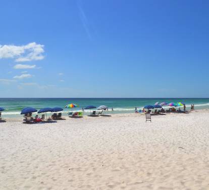 No chairs, no problem. Local beach service will set up chairs and an umbrella for you for an additional fee.