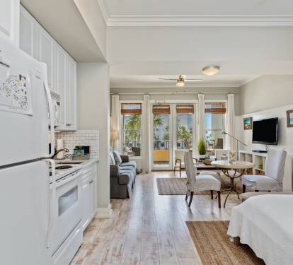 Bright 30A studio with a full kitchen, queen bed, sleeper sofa, and sunny balcony access. Steps from the beach, it’s the perfect blend of comfort and coastal style.