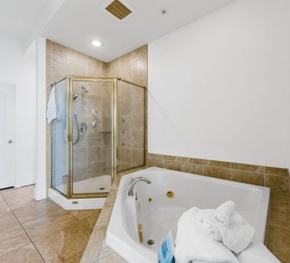 Caribe Penthouse C1 Primary Bathroom Jetted Tub and Separate Step-in Shower