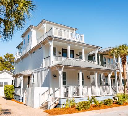 Bright 3-story home with separate carriage house, multiple porches and walkable access to the beach, pool, green space, restaurants and shops.