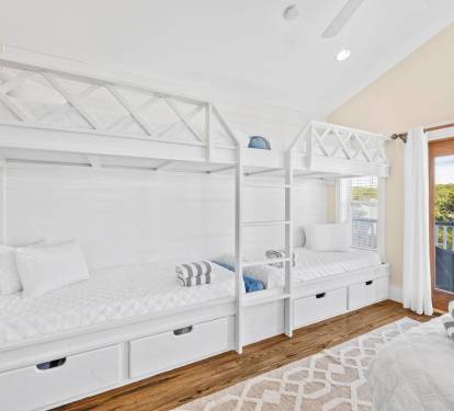 Four twin XL bunks on 3rd floor, along with queen bed and sitting area with wet bar and mini fridge.