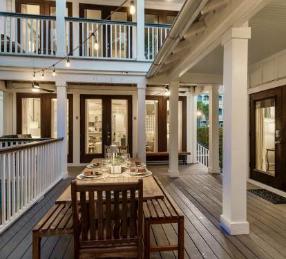 The breezeway connecting the main house and carriage house — your private campus for 16 guests. Two separate living spaces, one seamless experience.