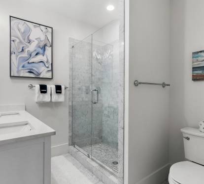 A master bathroom — double vanity, quality finishes, and enough space to actually get ready without a traffic jam.
