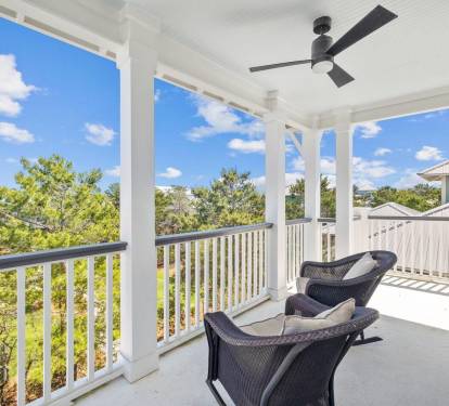 3rd floor back balcony overlooks beautiful green space.