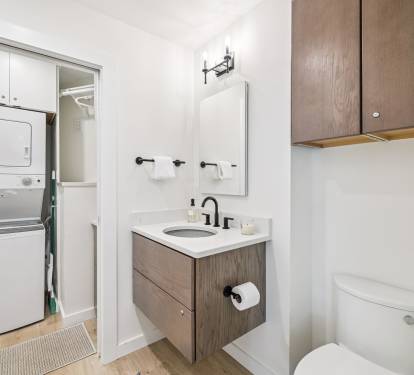 Conveniently Located 1st Floor Powder Room + Stack Washer & Dryer