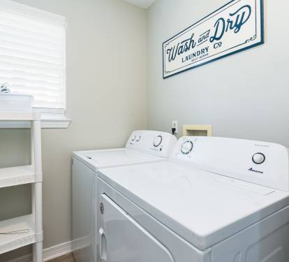 Blue Lagoon Laundry Room with Full Size Washer + Dryer
