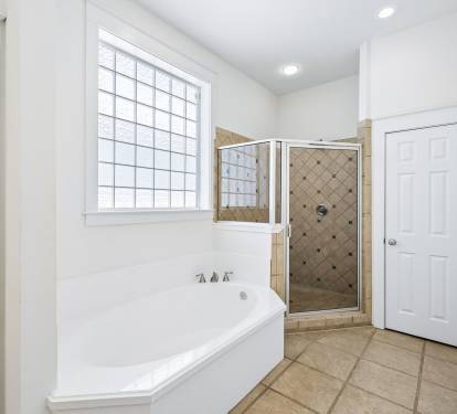 Primary King En-Suite - Soaking Tub + Walk-In Shower
