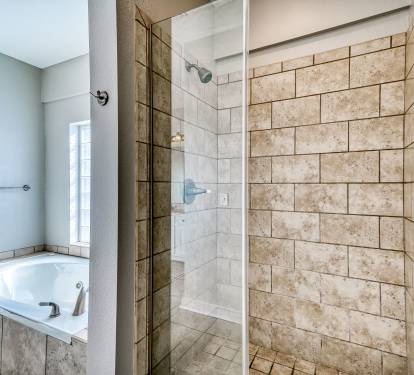 Primary King En-Suite - Soaking Tub + Walk-In Shower