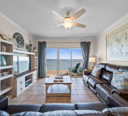 Unwind in your oceanfront living room where leather seating faces stunning sea views through floor-to-ceiling windows.
