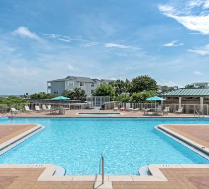 Dive into crystal-clear waters surrounded by swaying palms and coastal breezes. Lounge poolside under bright turquoise umbrellas, soak up the sun, and let your worries drift away in this serene oasis.