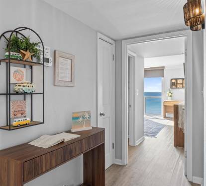 Step into your coastal retreat where ocean views greet you through every doorway, creating seamless indoor-outdoor flow.