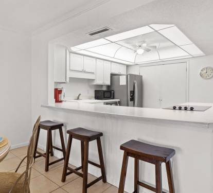 Your bright kitchen offers modern appliances and a breakfast bar where you can enjoy morning coffee or casual meals together.