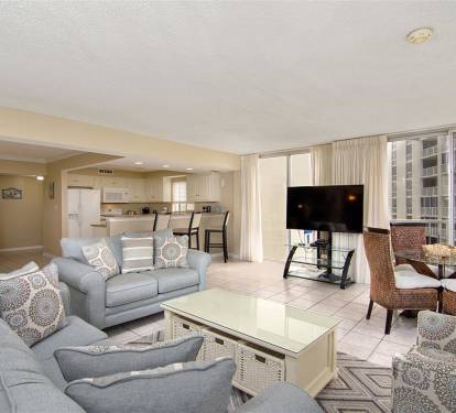 Sink into soft gray sofas and watch your favorite shows while city views stretch beyond the windows.