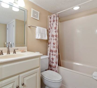 Your private bathroom features a full tub for relaxing soaks, plus fresh towels and all the essentials you need.