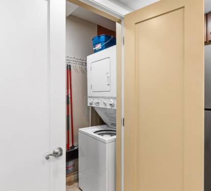 Your in-unit laundry closet features stacked washer and dryer with convenient storage space for all your cleaning supplies.