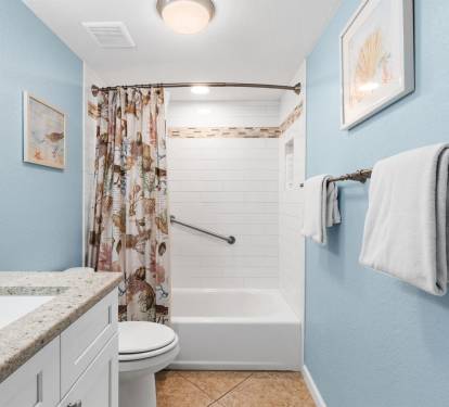 Refresh in your private bathroom with calming blue walls, granite counters, and a spacious tub-shower combo for relaxing soaks.