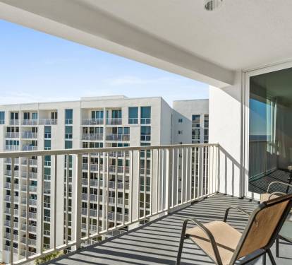 Relax on your private balcony with stunning ocean views and comfortable seating - your perfect retreat to watch the waves.