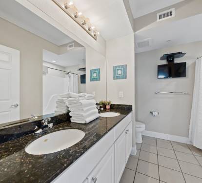 Crystal Tower 1101 Primary Bathroom with Dual Sinks and Television
