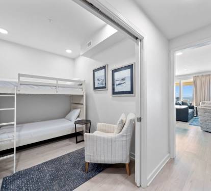 Your cozy bunk room features built-in storage and comfortable seating, perfect for kids or extra guests to unwind.