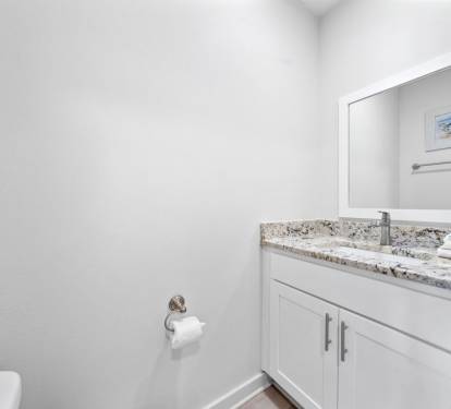 Refresh in your pristine guest bathroom with granite countertops and modern fixtures, complete with fresh towels waiting for you.