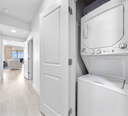 Your laundry needs are covered with this convenient in-unit washer and dryer, tucked away yet easily accessible from your bright hallway.