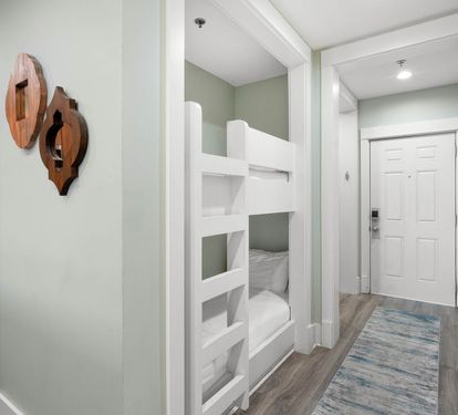 Your kids will love these stylish bunk beds tucked into this cozy nook, creating the perfect sleeping adventure.