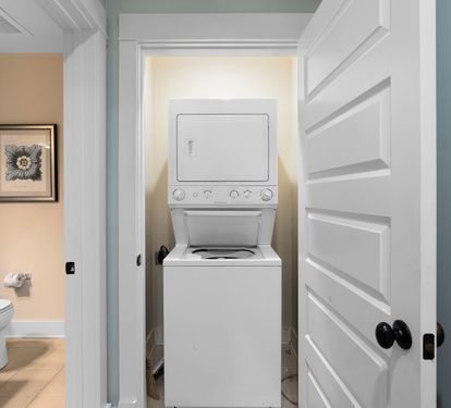 Your in-unit washer and dryer make extended stays effortless, tucked conveniently in a dedicated closet next to the bathroom.
