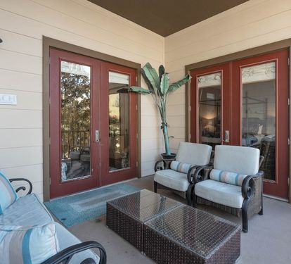 Step onto your private patio where coastal-style seating invites you to unwind with morning coffee or evening conversations in complete comfort.